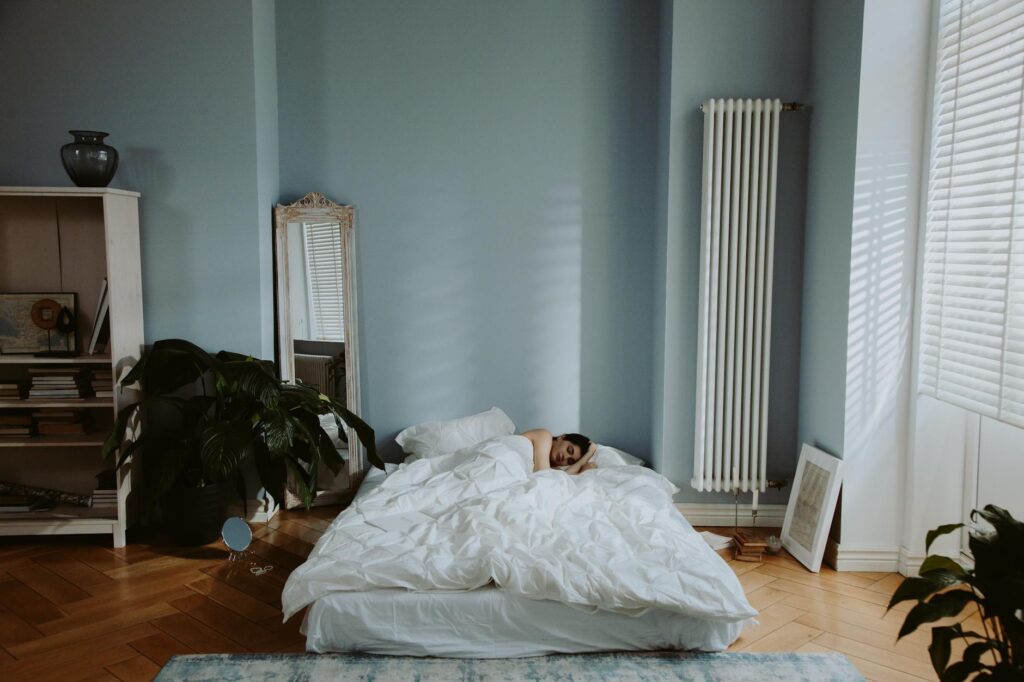 a person sleeping on the bed