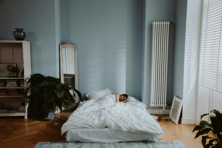 a person sleeping on the bed